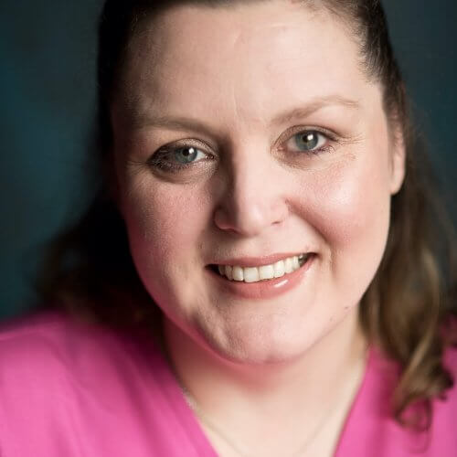 Dental Nurse Smiling with Black Hair