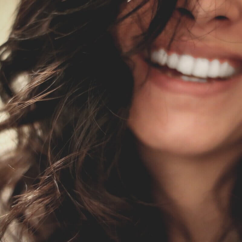 Women Smiling With Black Hair